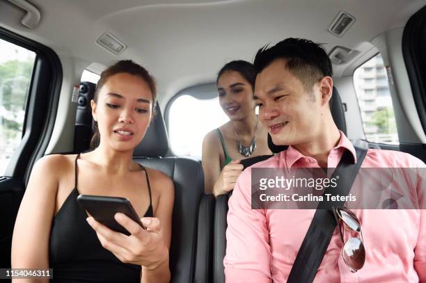 ride sharing passengers - stranger stock-fotos und bilder