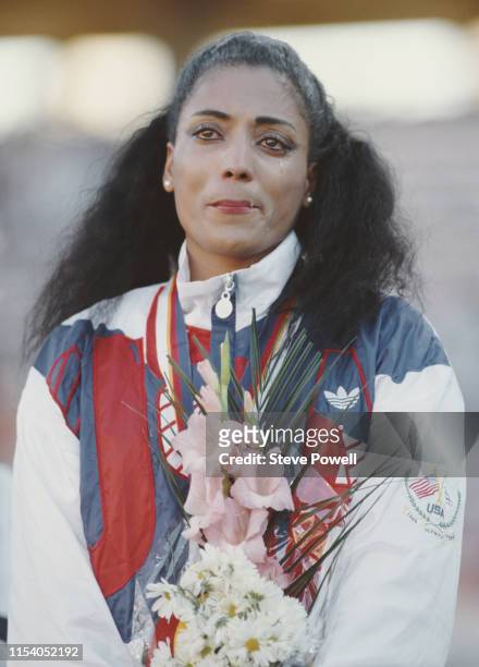 An emotional Florence Griffith-Joyner of the United States celebrates with her gold medal after winning the Women's 200 metres final event during the...