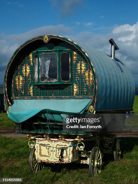 Decorative bow top caravan is parked in a field on the first day of the Appleby Horse Fair on June 06, 2019 in Appleby, England. The fair is an...