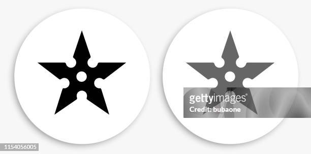 shuriken black and white round icon - throwing star stock illustrations