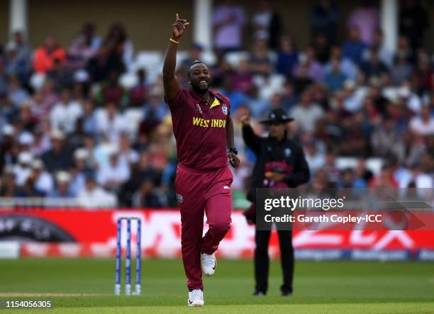 Andre Russell of West Indies celebrates after taking the wicket of Alex Carey of Australia during the Group Stage match of the ICC Cricket World Cup...