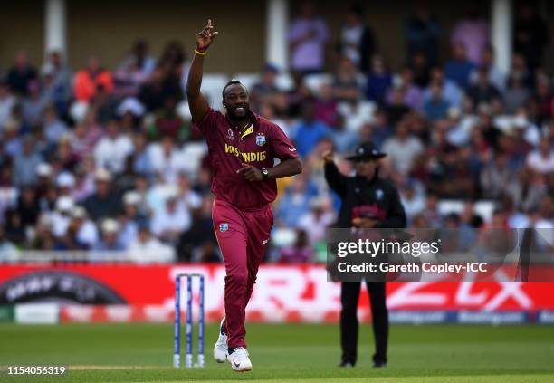 Andre Russell of West Indies celebrates after taking the wicket of Alex Carey of Australia during the Group Stage match of the ICC Cricket World Cup...