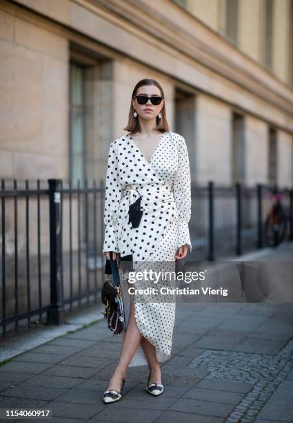 Swantje Sömmer is seen wearing white dress with black dots print Mother of Pearl, JW Anderson plaid bag, Prada shoes in black and white, Ray Ban...