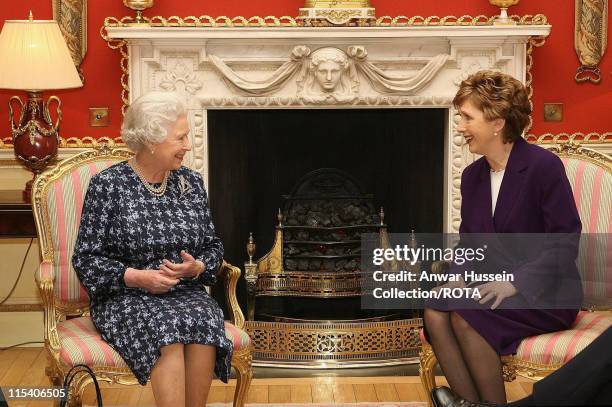 The Queen Elizabeth II talks with Irish President Mary McAleese at Hillsborough Castle, Belfast, Thursday December 8, 2005. It is the Queen's first...