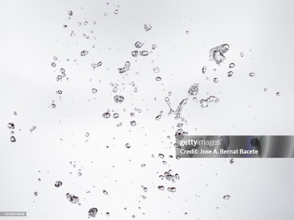 Figures and abstract forms of water on a white background.