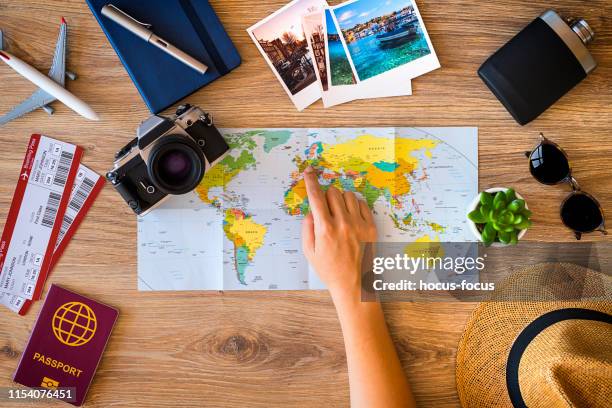 planning a travel - woman map stock pictures, royalty-free photos & images