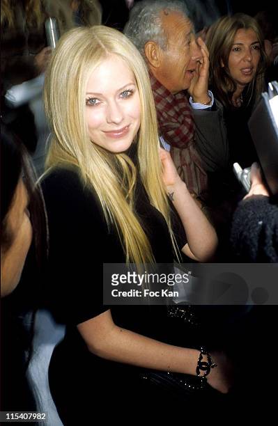 Avril Lavigne, Gilles Bensimon and Guest during Paris Fashion Week - Haute Couture Spring Summer 2006 - Chanel at Grand Palais in Paris, France.