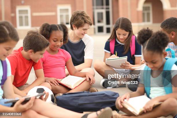 group of school children, friends studying together on campus. - junior high student stock pictures, royalty-free photos & images