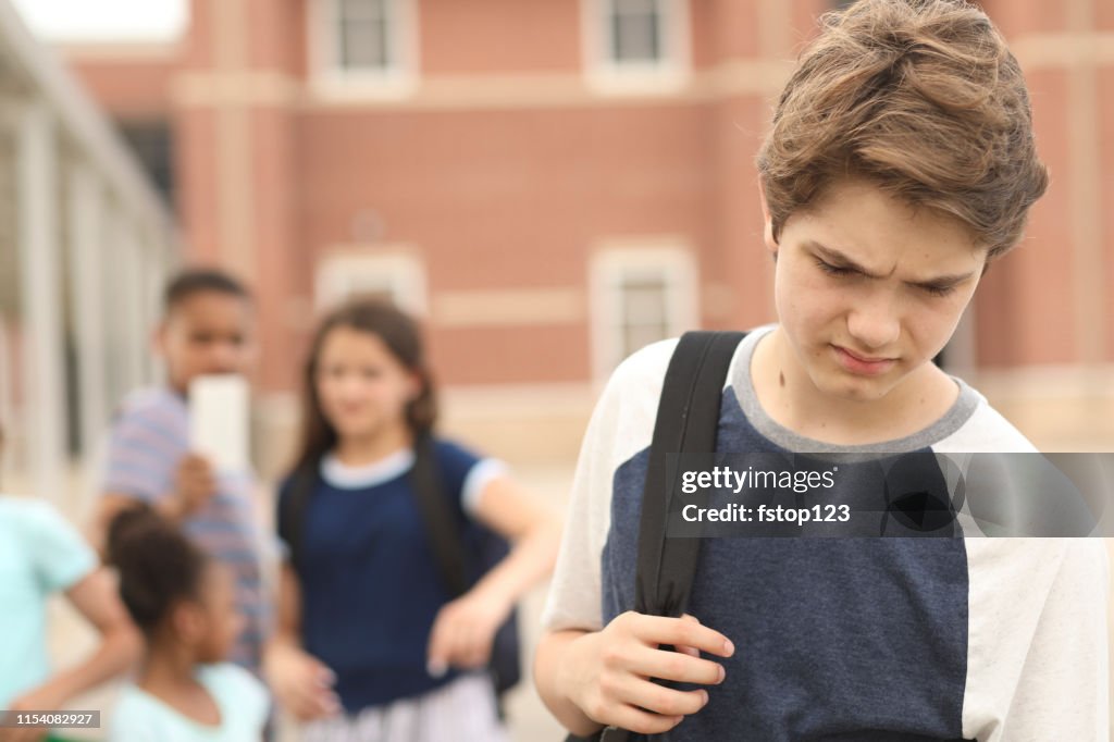 Junior high age boy being bullied at school.