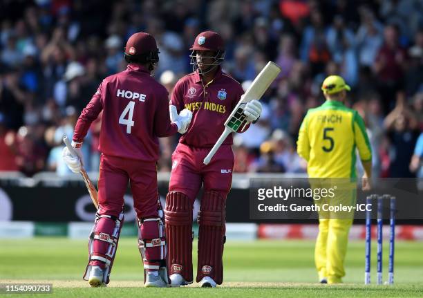 Shai Hope and Shimron Hetmyer of West Indies shake hands after sharing a 50 partnership during the Group Stage match of the ICC Cricket World Cup...