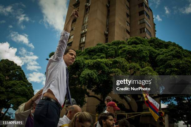 Venezuela's opposition leader Juan Guaido speaks during a march during a march against the government in Caracas on July 5 during the anniversary of...