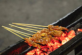 Sate Ayam is such a unique type of Indonesian sate.The skewers of chicken on a gridiron over fire.
