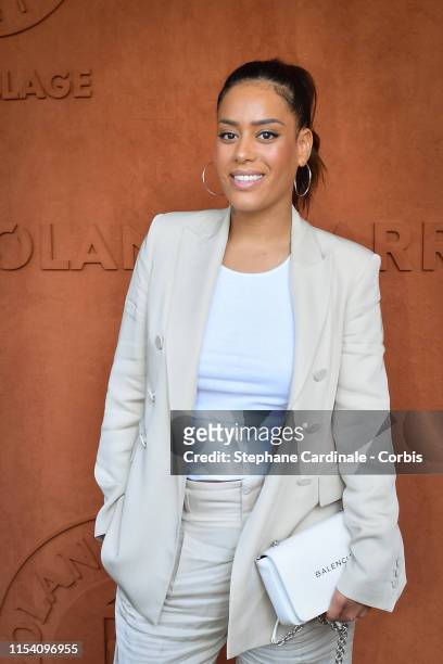 Singer Amel Bent attends the 2019 French Tennis Open - Day Twelve at Roland Garros on June 06, 2019 in Paris, France.