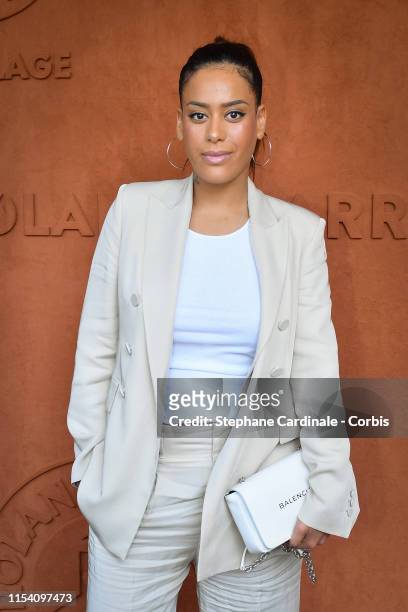 Singer Amel Bent attends the 2019 French Tennis Open - Day Twelve at Roland Garros on June 06, 2019 in Paris, France.
