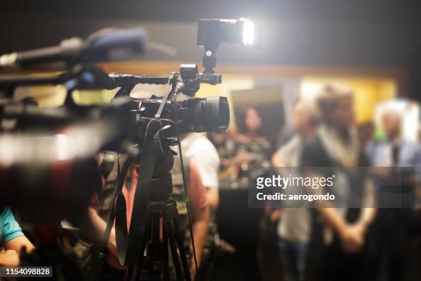 people photographing at event - press conference stock pictures, royalty-free photos & images