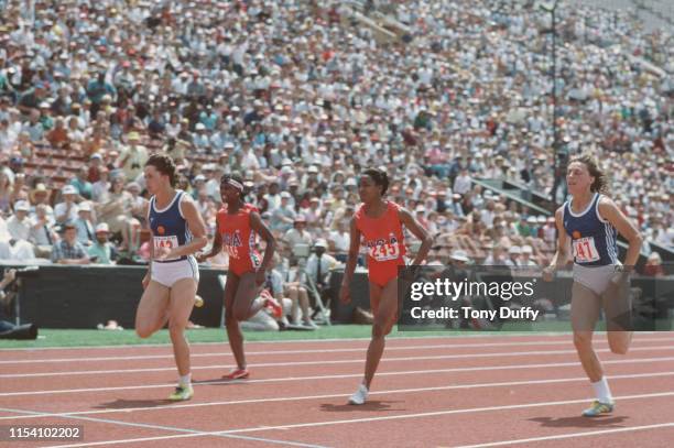 Marlies Gohr of East Germany sprints to line to win the Women's 100 meters competition ahead of Diane Williams and Evelyn Ashford of the United...