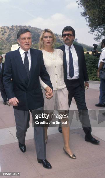 Hugh Hefner, Kimberly Conrad and Guest during Funeral for Sammy Davis Jr. - May 18, 1990 at Forest Lawn Memorial Park in Los Angeles, California,...