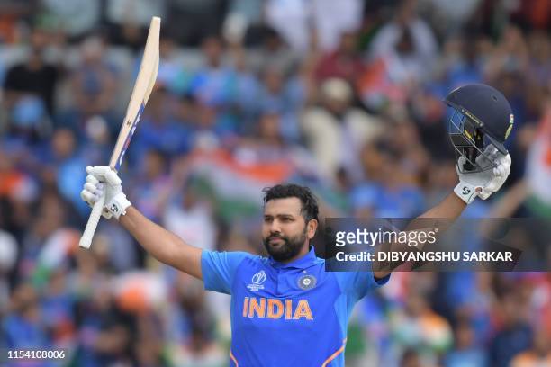 India's Rohit Sharma celebrates after reaching his century during the 2019 Cricket World Cup group stage match between Sri Lanka and India at...