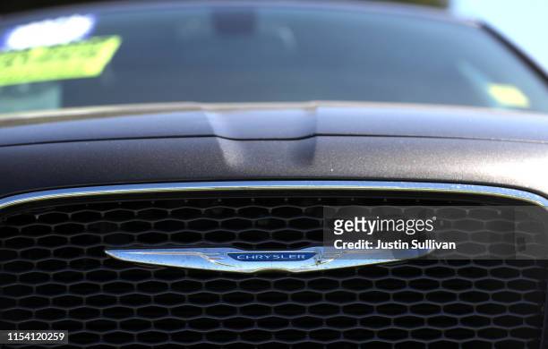The Chrysler logo is displayed on a car at a Chrysler dealership on June 06, 2019 in Richmond, California. Fiat Chrysler announced that it has...