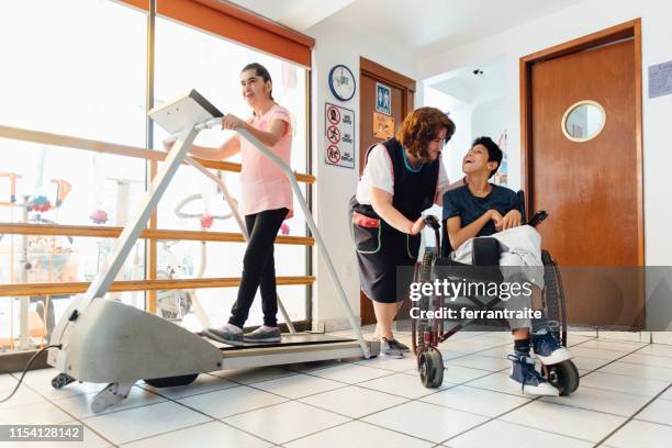 disabled kids doing physical therapy at school - brain damage stock pictures, royalty-free photos & images