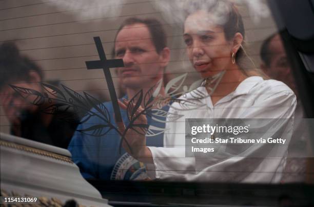 Chanov, Czech Republic. July 9, 1999. Roma Funeral. -- The fiancee of the deceased man and her brother grieved as the hearse toured the apartment...