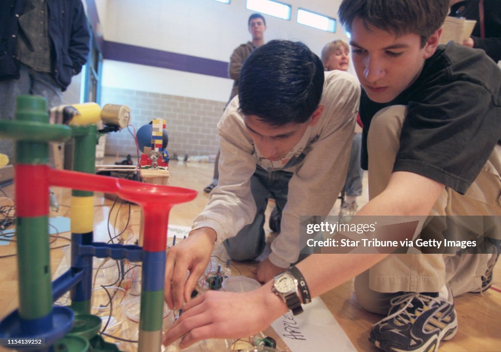 Minnesota High School Science Olympiad. -- Competing in the ìMission Possibleî section, Jacob Haqqímisra, 17 and Nate Twedten, 17, fine tune their machine. The object here was to catapault a ball with a set up that used a number of scientific