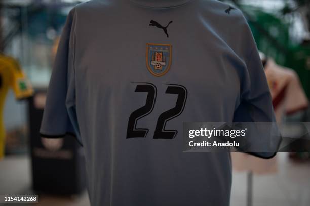 Uruguayan national team player Edinson Cavani's jersey is shown during the San Siro jersey museum exhibition in Bogota, Colombia on July 05, 2019. An...