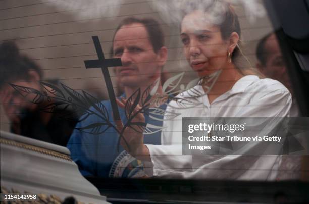 Chanov, Czech Republic. July 9, 1999. Roma Funeral. -- The fiancee of the deceased man and her brother grieved as the hearse toured the apartment...