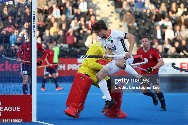 Florian Fuchs of Germany battles with George Pinner of Great Britain during the Men's FIH Field Hockey Pro League match between Great Britain and...