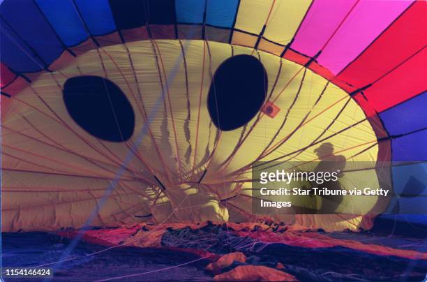 Story about Matt Wiederkehr's hot air balloon business in Lakeland. IN THIS PHOTO: Lakeland, Mn., Fri., Sept. 15, 2000--Matt Wiederkehr casts a...