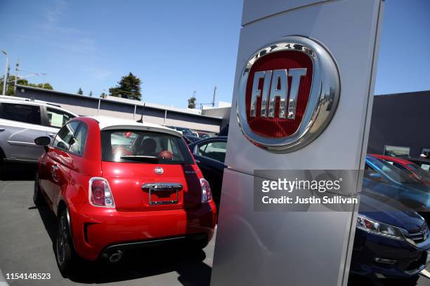The Fiat logo is displayed on a car at a Fiat dealership on June 06, 2019 in Burlingame, California. Fiat Chrysler announced that it has withdrawn a...