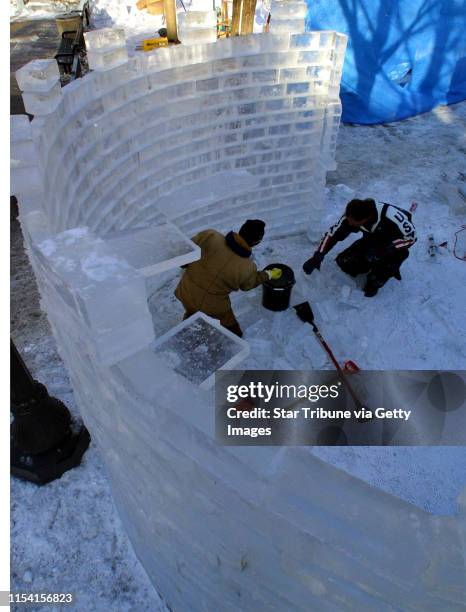 Bob Halveson of Ham Lake, a wood sculptor by trade, changes medium by working with blocks of ice in the Winter Carnival multi-block ice sculpture...
