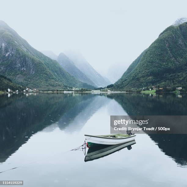 calm evening by the fjord - pontoon boat stock pictures, royalty-free photos & images