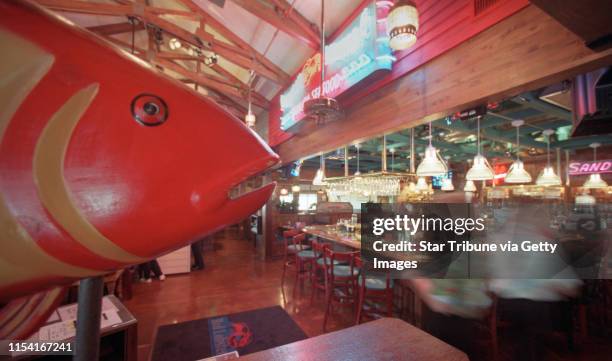 Maple Grove, Mn., Tues., Apr. 10, 2001--A large carved fish sits on a partition at the hostess station of the Maple Grove Red Lobster. The bar area...