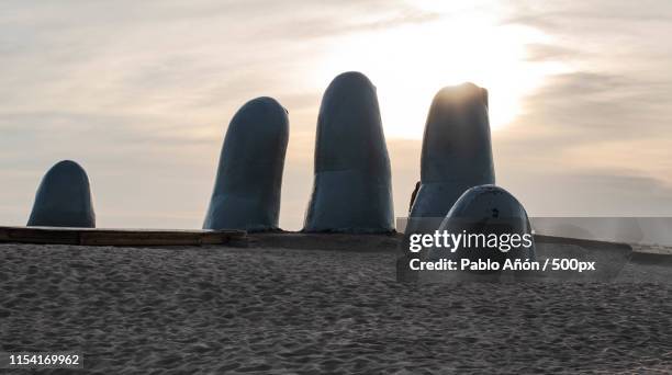 fingers punta del este - punta del este stock pictures, royalty-free photos & images