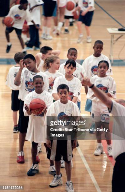 Coaches gave basketball clinics at Ganglehoff Center at Concordia College. IN THIS PHOTO: St. Paul, Mn., Sat., Mar. 31, 2001-- Ten-year-old Brandon...