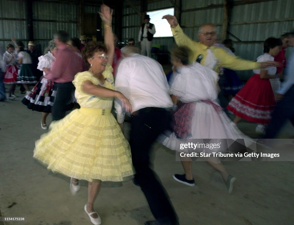 GENERAL INFORMATION: Nowthen MN, 8/19/01 Nowthen Threshing show---
IN THIS PHOTO: Nowthen MN, 8/19/01 Nowthen Threshing show---Kenneth Schumacher of Blaine MN, dance with his wife JoAnne Prusihski during Sunday's Nowthen Threshing show. The dancers ar