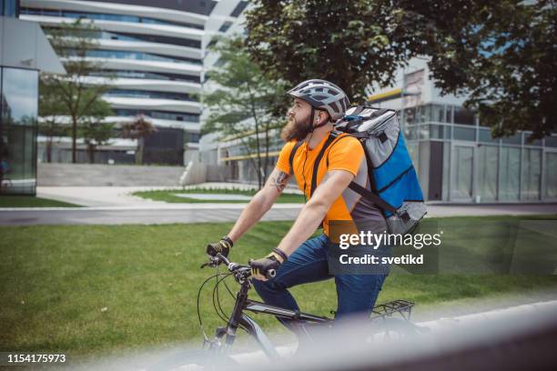 bicycle delivery - bicycle courier stock pictures, royalty-free photos & images