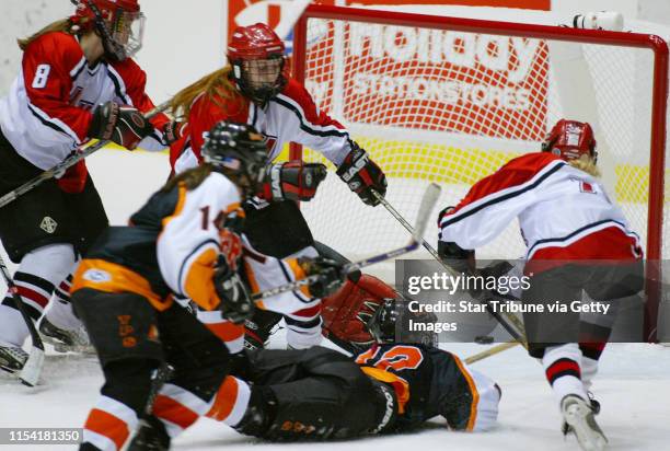 St. Paul MN 2/21/02 Lakeville vs White Bear Lake-----Melissa Mondo 12, of White Bear Lake shoots the puck passed Lakeville Christine Seiler...