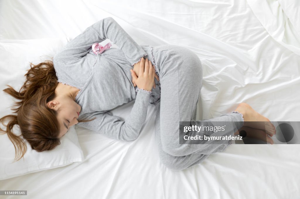Yoıung woman stomachache, feel pain