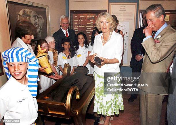 Prince of Wales and HRH Duchess of Cornwall are unexpectedly called upon to help disembowel a corpse at the Egypt centre at Swansea University on the...