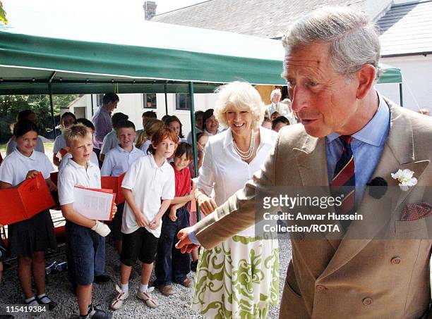 Prince of Wales and HRH Duchess of Cornwall meet school children when they visit Rhossili village hall, Middleton, Gower on the second day of their...