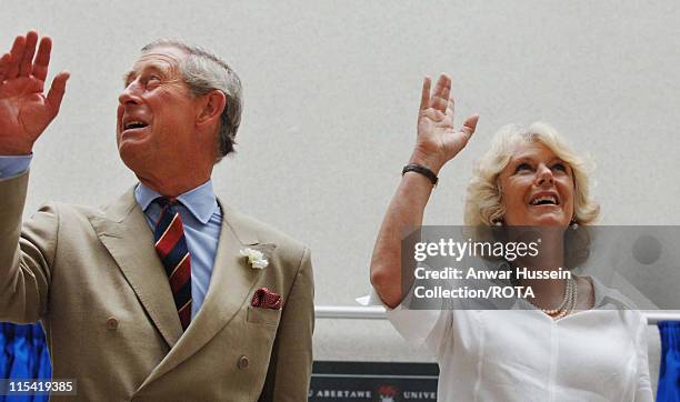 Prince of Wales and HRH Duchess of Cornwall wave as they visit the University of Wales, Swansea on the second day of their summer tour of Wales, July...