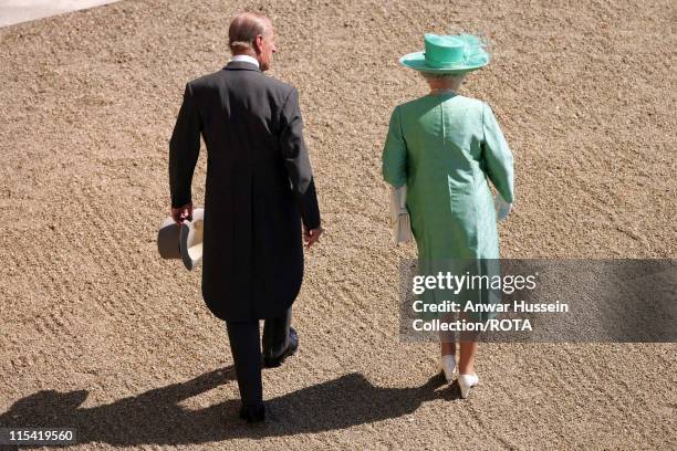 Queen Elizabeth ll, accompanied by Prince Philip, Duke of Edinburgh, hosts a Garden Party at Buckingham Palace on July 11 2006.