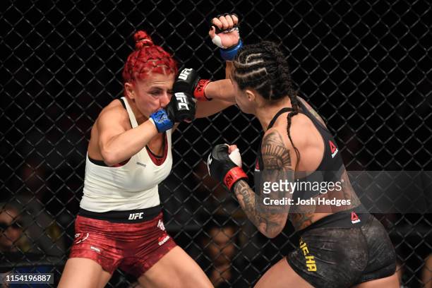 Claudia Gadelha of Brazil punches Randa Markos of Canada in their strawweight fight during the UFC 239 event at T-Mobile Arena on July 6, 2019 in Las...