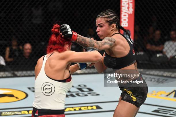 Claudia Gadelha of Brazil punches Randa Markos of Canada in their strawweight fight during the UFC 239 event at T-Mobile Arena on July 6, 2019 in Las...