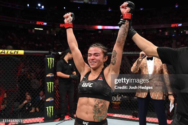 Claudia Gadelha of Brazil celebrates her win against Randa Markos of Canada in their strawweight fight during the UFC 239 event at T-Mobile Arena on...