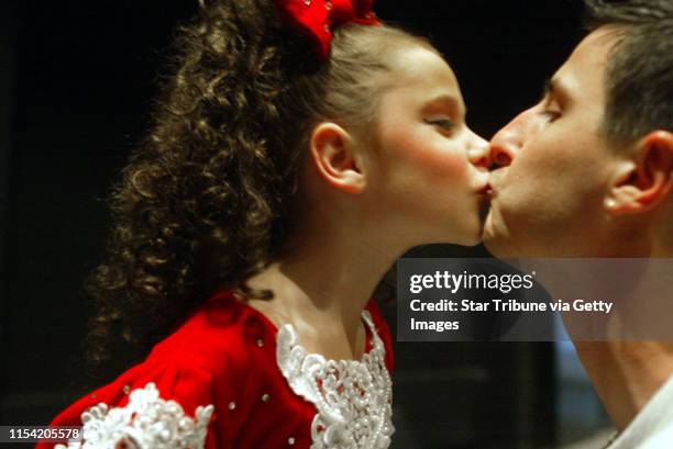 St. Paul MN. 6/3/2002--St. Paul MN. 6/3/2002--6 yr. Old Kayla Giannini gets a pre-performance kiss backstage from her Dancin' Dad Joe Giannini...
