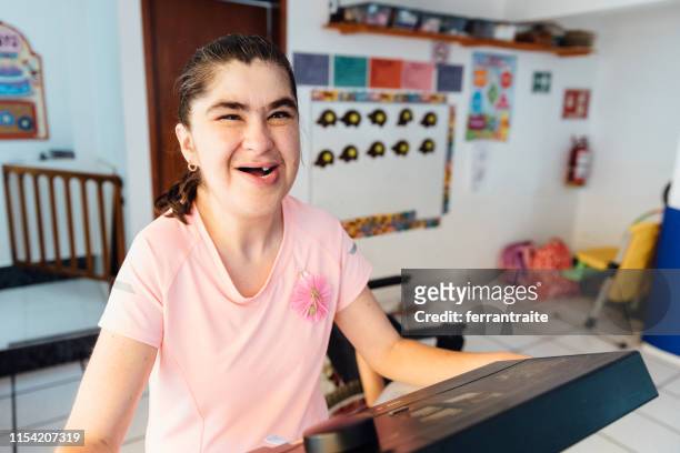 disabled kids doing physical therapy at school - teenager cerebral palsy stock pictures, royalty-free photos & images