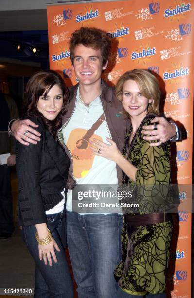Sophia Bush, Tyler Hilton and Hilarie Burton during The Cast of "One Tree Hill" Appears at FYE in New York City - February 7, 2006 at FYE in New York...